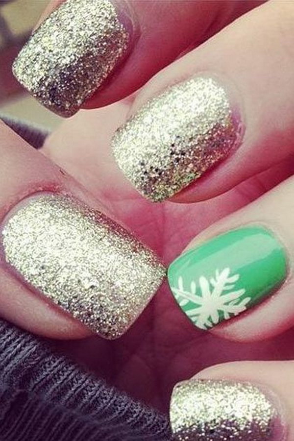 SnowFlake on Green Background and Golden Glitter Nails. 