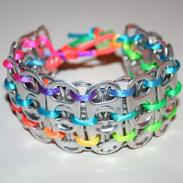 Rainbow pop can tab cuff bracelet. After drinking soda from aluminum cans, you can recycle your soda cans to create interesting projects instead of tossing the empty cans into the garbage or recycling bin. 