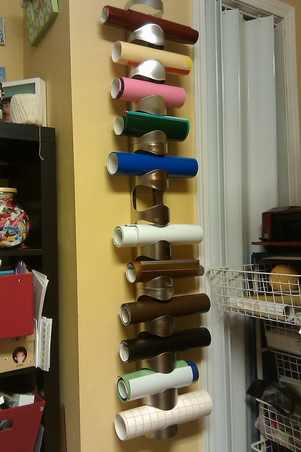 Vinyl or wrapping paper storage using IKEA wine racks. It costs under $25 and took 20 minutes to get it set up on the wall. 