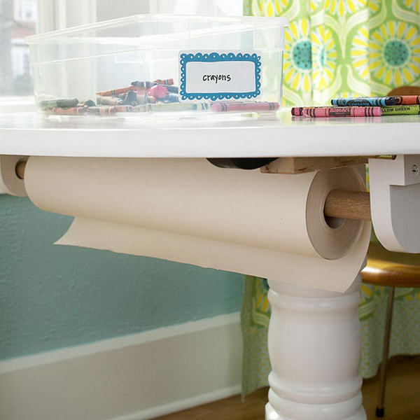 Screw a holder to the bottom of the table for storing a spool of wrapping paper. 