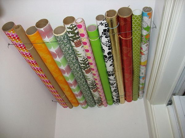 Store your wrapping paper with wasted ceiling space in a closet. 