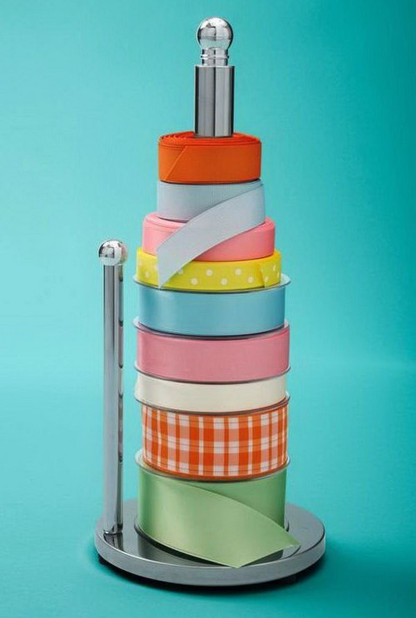 Use a paper towel holder to keep your spools of ribbon organized and easy to get to. 