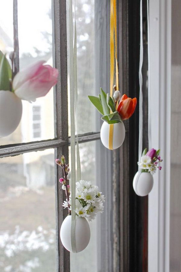 DIY Hanging Easter Eggs. Beautiful sunlight shines through your window in the Easter morning. Create this cool installation of light egg vase with flowers on your window. 
