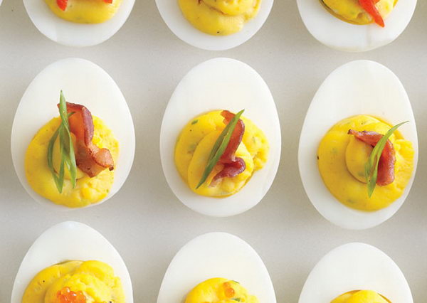 Bacon Deviled Eggs. Drain the boiled eggs, remove yolks, mash reserved yolks, bacon fat, mayonnaise, mustard, scallions and season with salt and pepper for tasty flavor to fill your guests with energy after the exciting party events. 