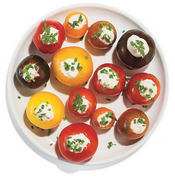 Horseradish Stuffed Cherry Tomatoes. Use small knife to scoop out centers of cherry tomatoes, spike mayonnaise with horseradish. Top it with fresh herbs to present a beautiful outlook. It's super chic to serve your guests with this dinner party food. 