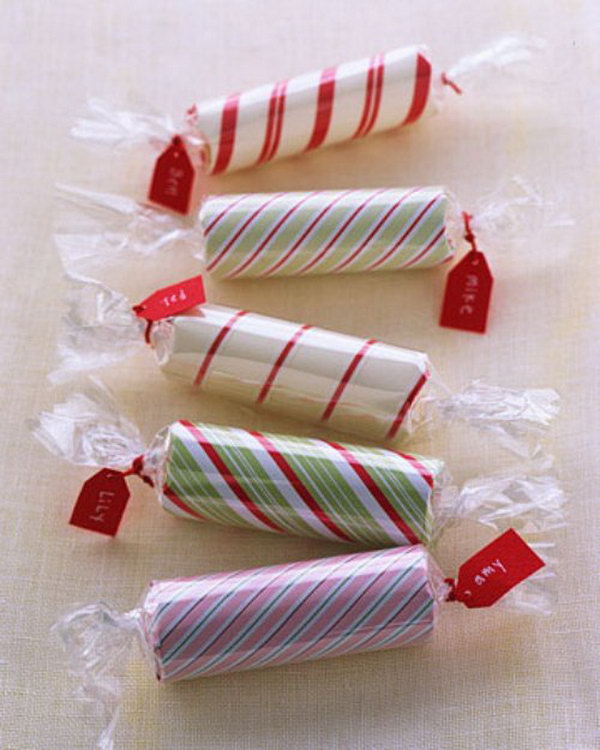 Candy Coins. It's inconvenient to take your pile of coins. Wrap roll of coins with wrapping paper in rectangle shape and attach quilling strip with tapes. Add cellophane, twist ends and attach tags with yarn to pack the coins in this super chic way with little costs. 