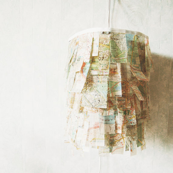 City Lamp Map Art. Add mod podge to map paper to make it stronger and more transparent. Use the treated map paper to wrap up the lampshade. Place energy saving bulbs in the lamp to finish off this unique and lush lamp which is perfect for dining table lighting. 