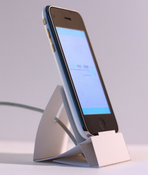 Paper iPhone Dock. Just download and print out the template for this paper iPhone dock. Set up your iPhone dock from the folded cardstock. It's easy to make yet very useful to display your iPhone device. 