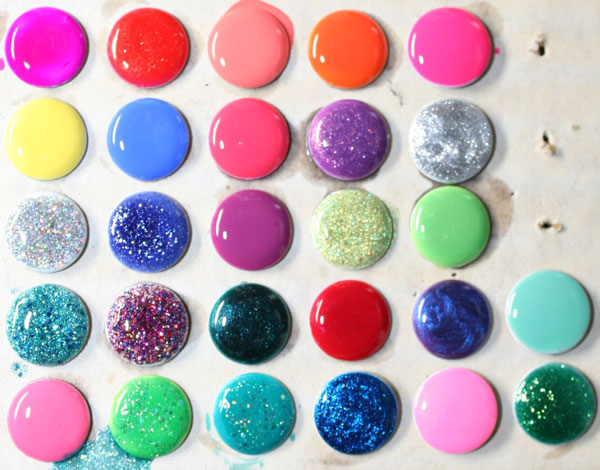 DIY Polished Push Pins. Use your new spring colors set of nail polish to create some glitter and colorful push pins. 