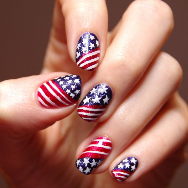 Patriotic Glitter Stars and Stripes Nail Art: Go with the classic patterns, but use glitter polish. Your nail art looks totally something but tacky. See the tutorial here. 