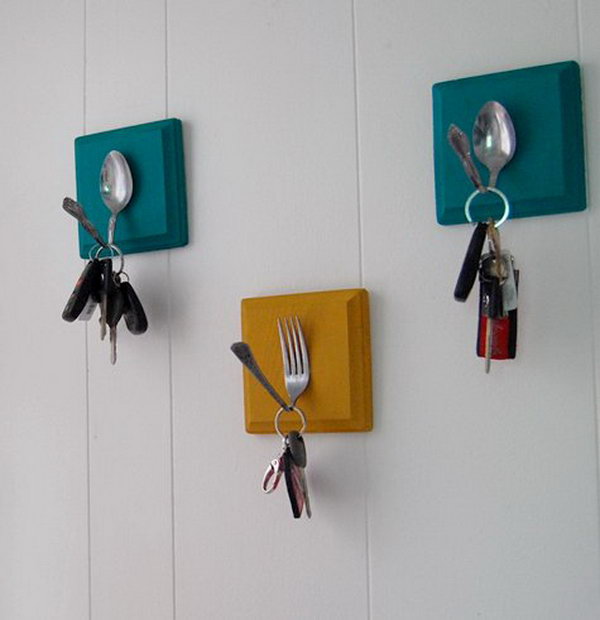 DIY Key Holder with Old Spoons and Forks. A creative way to transfer the old utensils into a key holder. Have some small blocks of wood painted, secure them to the wall, then glue on bent utensils for a pretty way to never lose your keys again. Follow the tutorial 