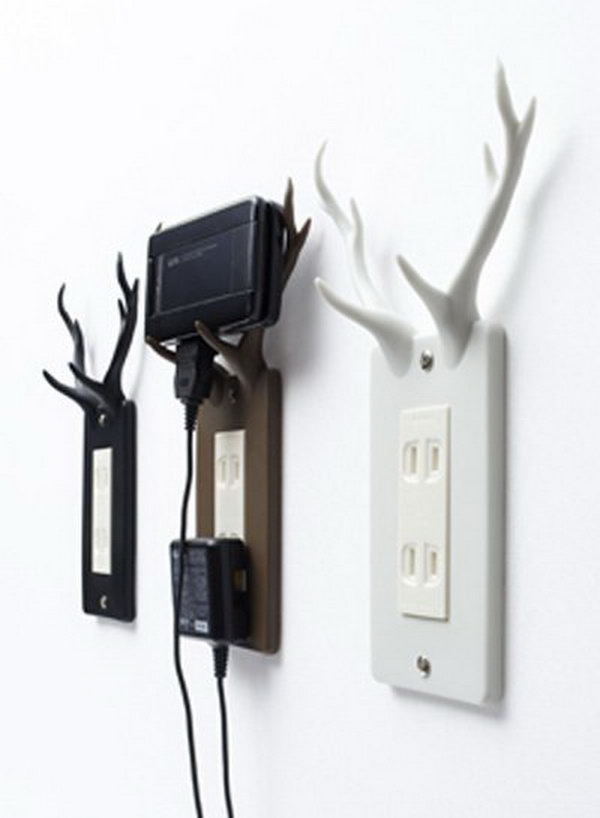 Outlet Plate Uses Antlers to Hold Charging Phones 