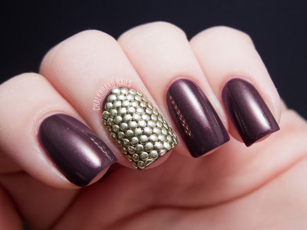 Purple Background with Stud Armor Accent Nail. 