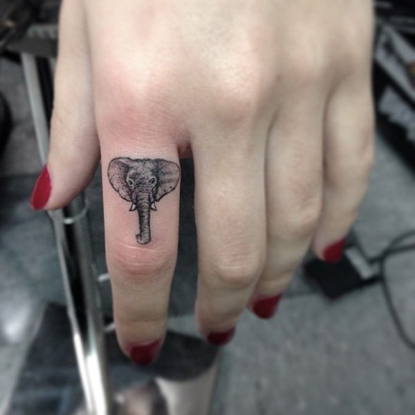 Small Finger Elephant Head Tattoo. 