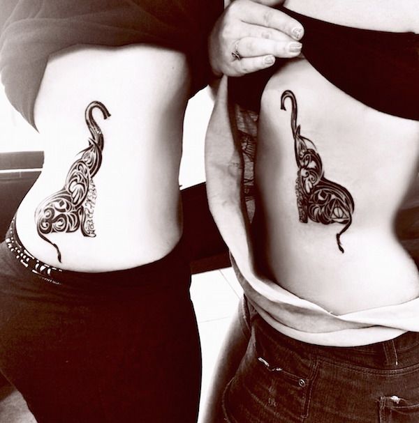 Matching Elephant Tattoos. 