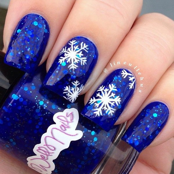 Snowflakes Design on Blue Glitter Nails 