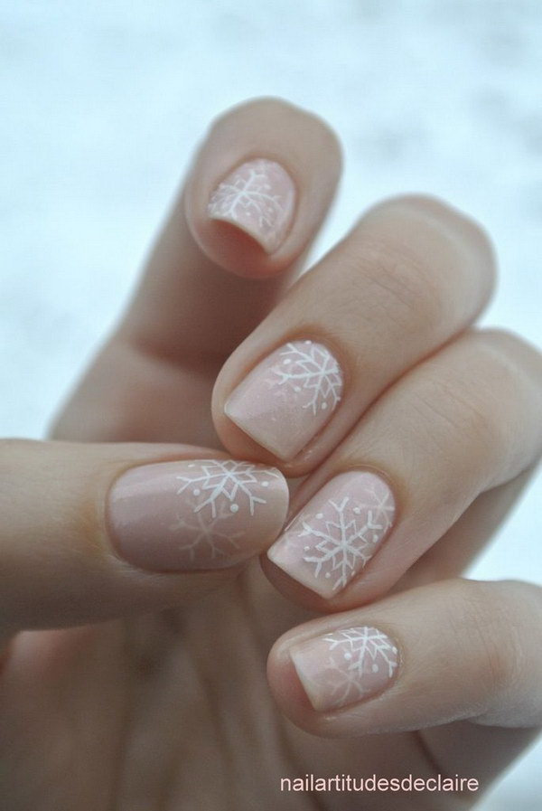White Snowflakes on Pale Pink Nails. 