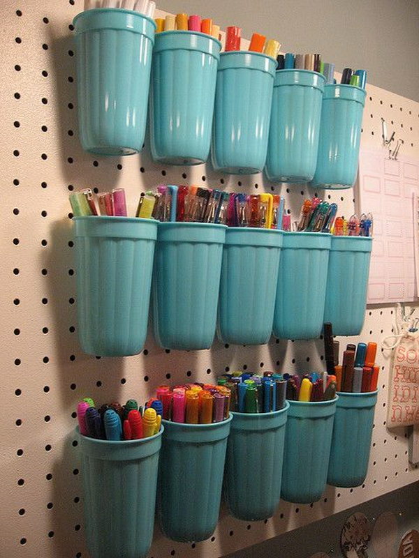 Plastic Cups on a Pegboard. 