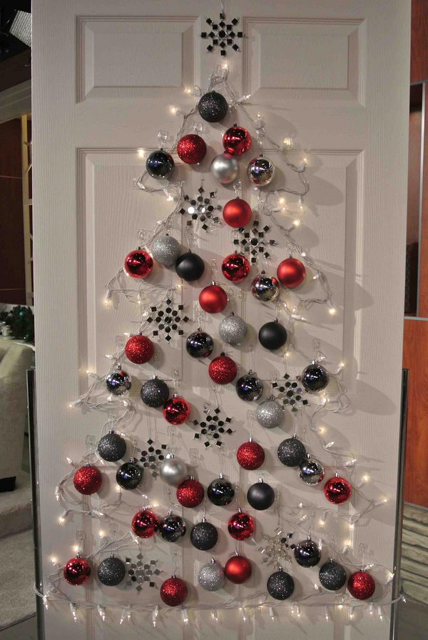 Hang Christmas Balls in The Shape of a Christmas Tree on a Screened Door. 