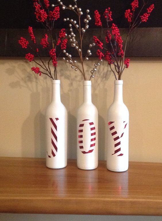 Painted Wine Bottles with Letters JOY in Red and White . 