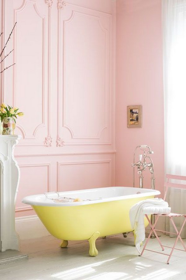 Pink Bathroom With Yellow Roll Top Bath 