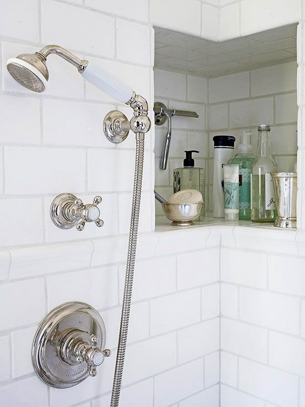 This shower niche wraps around a corner for a bit of extra room for shampoos, soaps, a razor, and other necessities. 