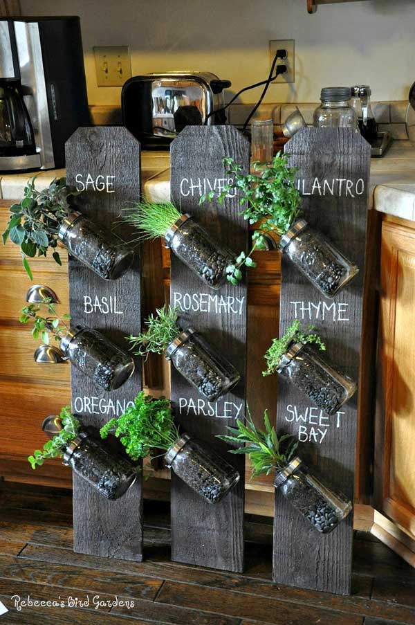 Make a Vertical Indoor Herb Garden Using Pallet Wood with Mason Jars. 